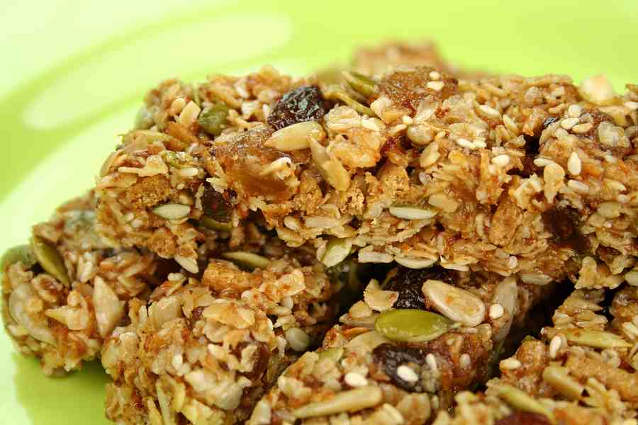 Delicious homemade peanut butter bars with oats, seeds, and chocolate chips. Perfect for a sweet, he.