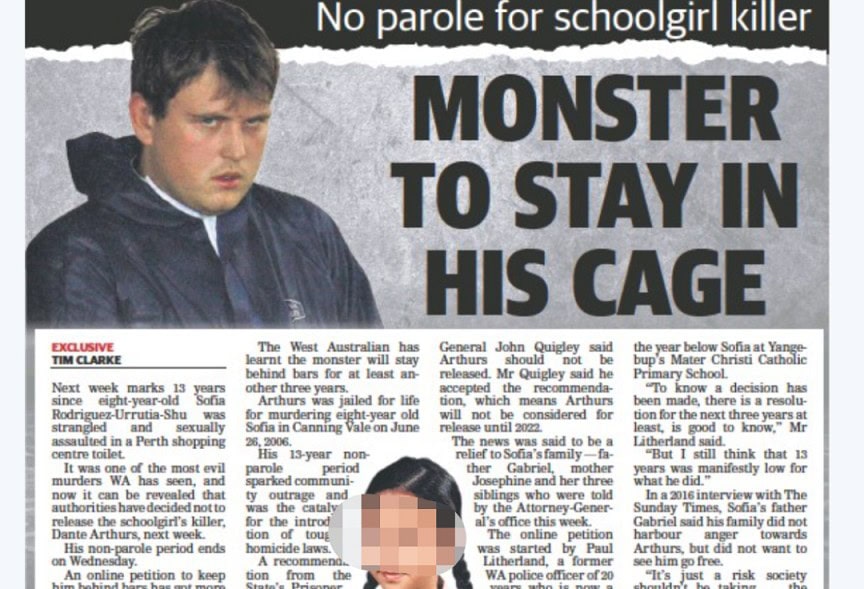 Young boy looking serious, feeling confined in a cage.