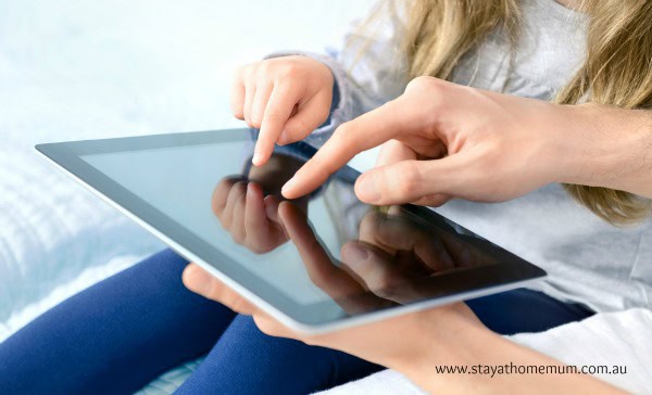 Child using a tablet with educational apps for preschoolers.