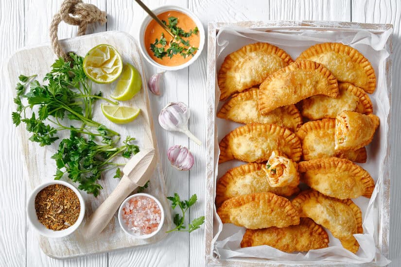 Authentic Spanish empanadas served with fresh herbs, lemon, and flavorful dipping sauce. Perfect for.