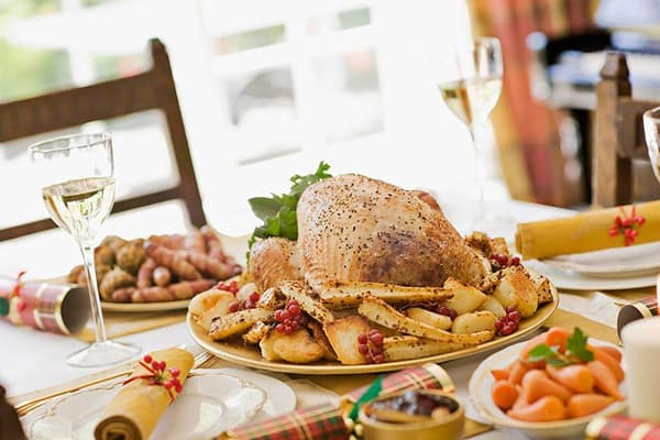 Traditional Christmas turkey with vegetables and sides.