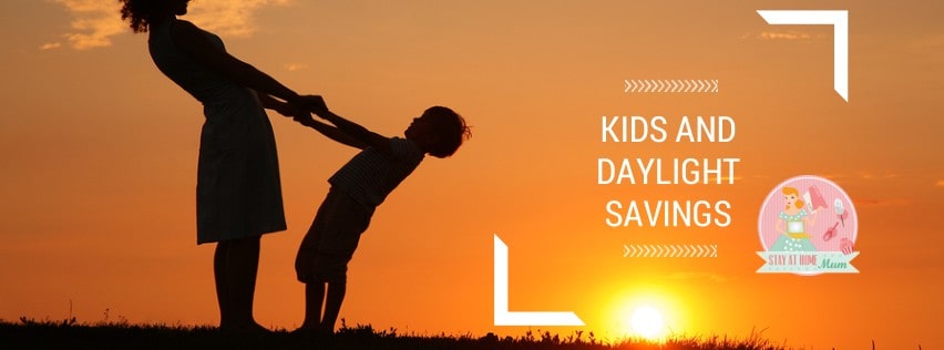 Kids enjoying daylight savings time outdoors at sunset.