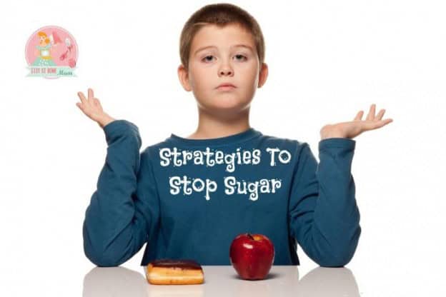 Child with apple and snack, promoting sugar reduction strategies.
