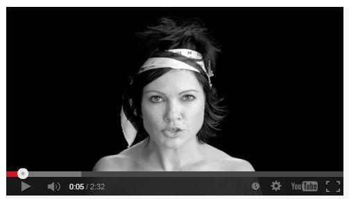 Woman with headband making a confident expression, promoting self-care and empowerment.