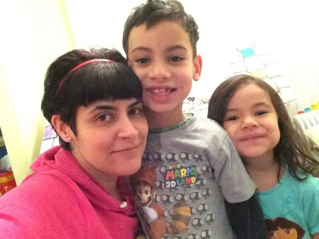Mother and children enjoying quality time indoors.