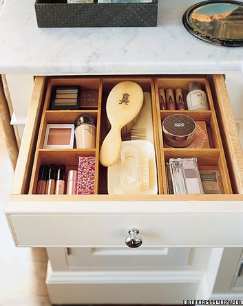 Neatly arranged bathroom cupboard with cosmetics and toiletries.