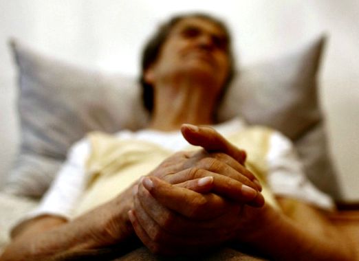 Elderly woman contemplating mortality, reflecting on life's end.