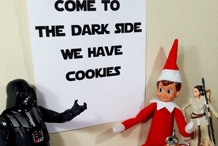 Elf on the Shelf dressed as Star Wars character with Darth Vader figure.