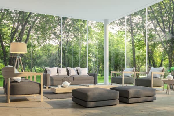 Elegant living room with large glass windows and stylish furniture.