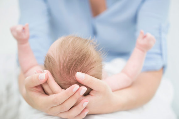 Infant with adult-like genitalia, raising concerns about early sexual development.