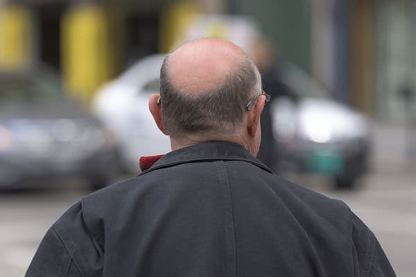 Elderly man saves young girl from kidnapping attempt on city street.