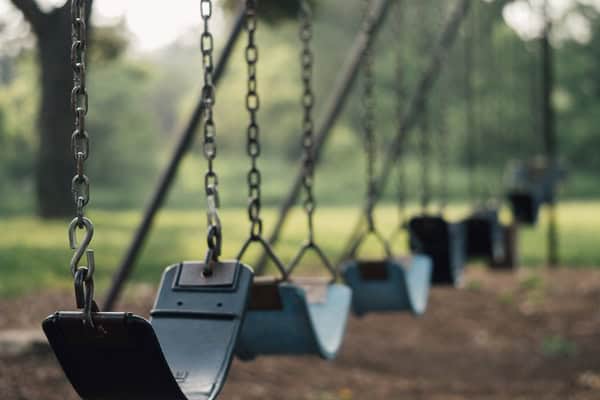 Child safety concerns at playground swings.