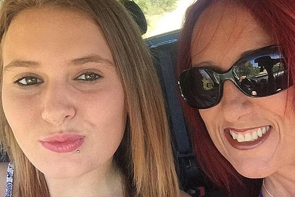 Mother and daughter in car after crash, highlighting tragic incident.