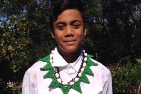 Child wearing traditional attire during rescue operation at Maroubra Beach.