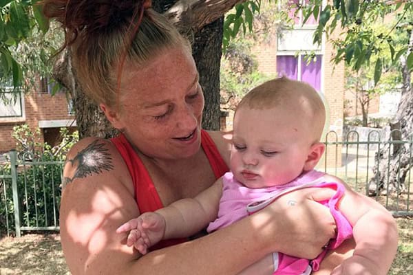 Hero dad throws baby out window to save her from fire.