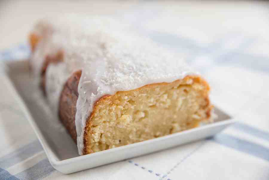 Delicious coconut pound cake with a moist texture and sweet coconut topping. Perfect for dessert or.