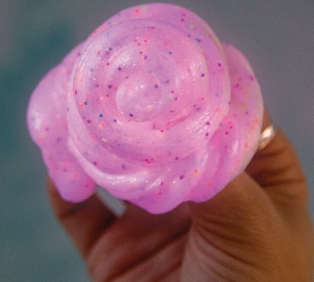 Pink swirl slime with glitter for sensory calming activities.