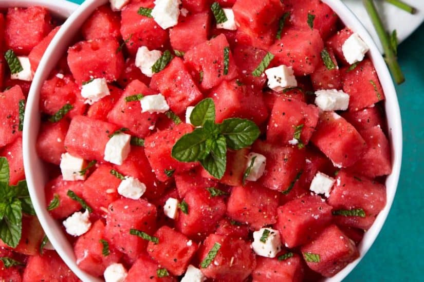 Refreshing summer watermelon salad with feta cheese and fresh mint leaves.