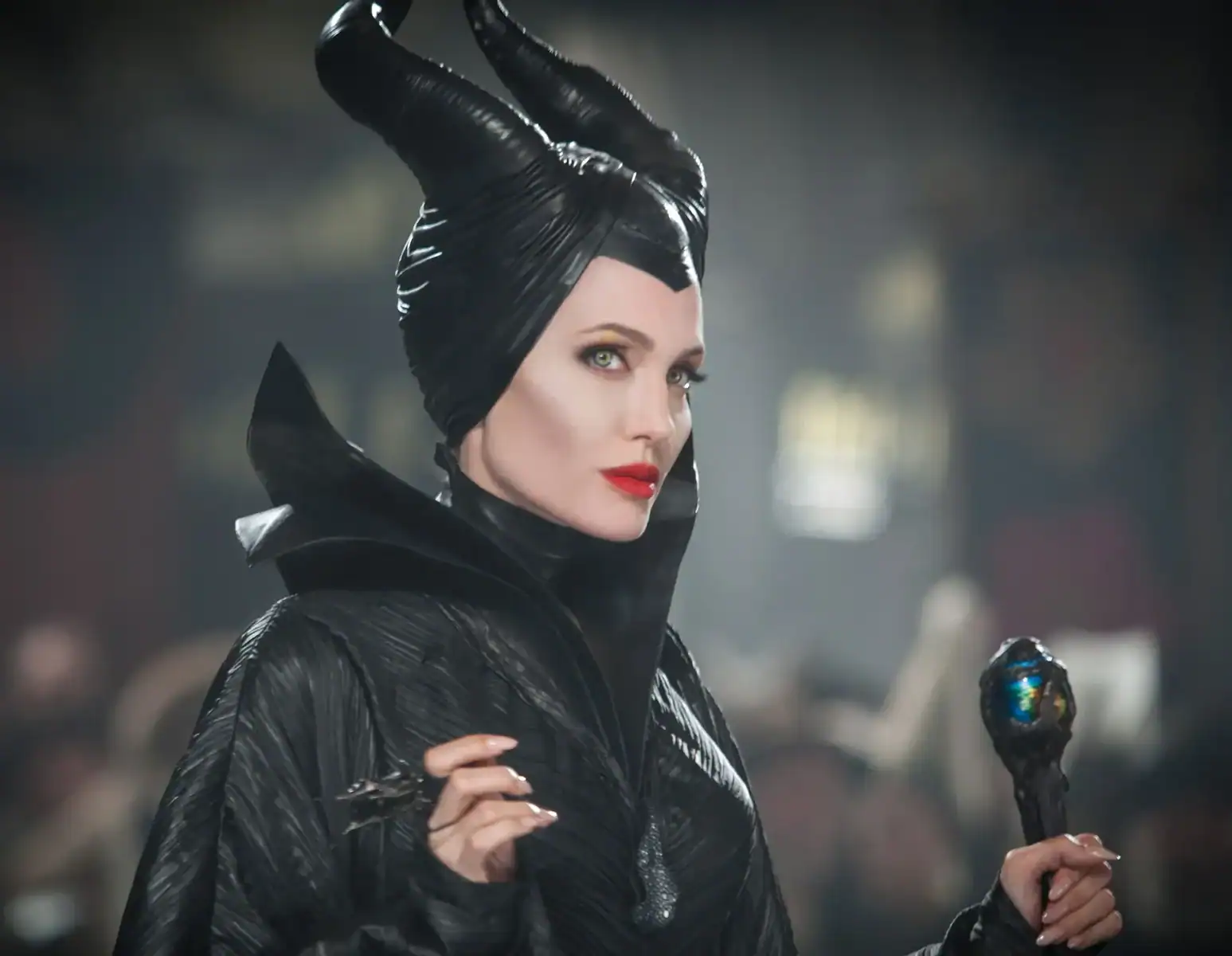 Iconic TV witch with a black costume and headpiece, holding a magic staff.