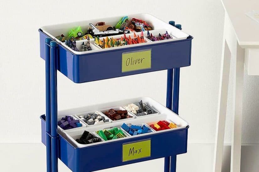 Nappy caddy repurposed for organising toys and craft supplies in a child's room.