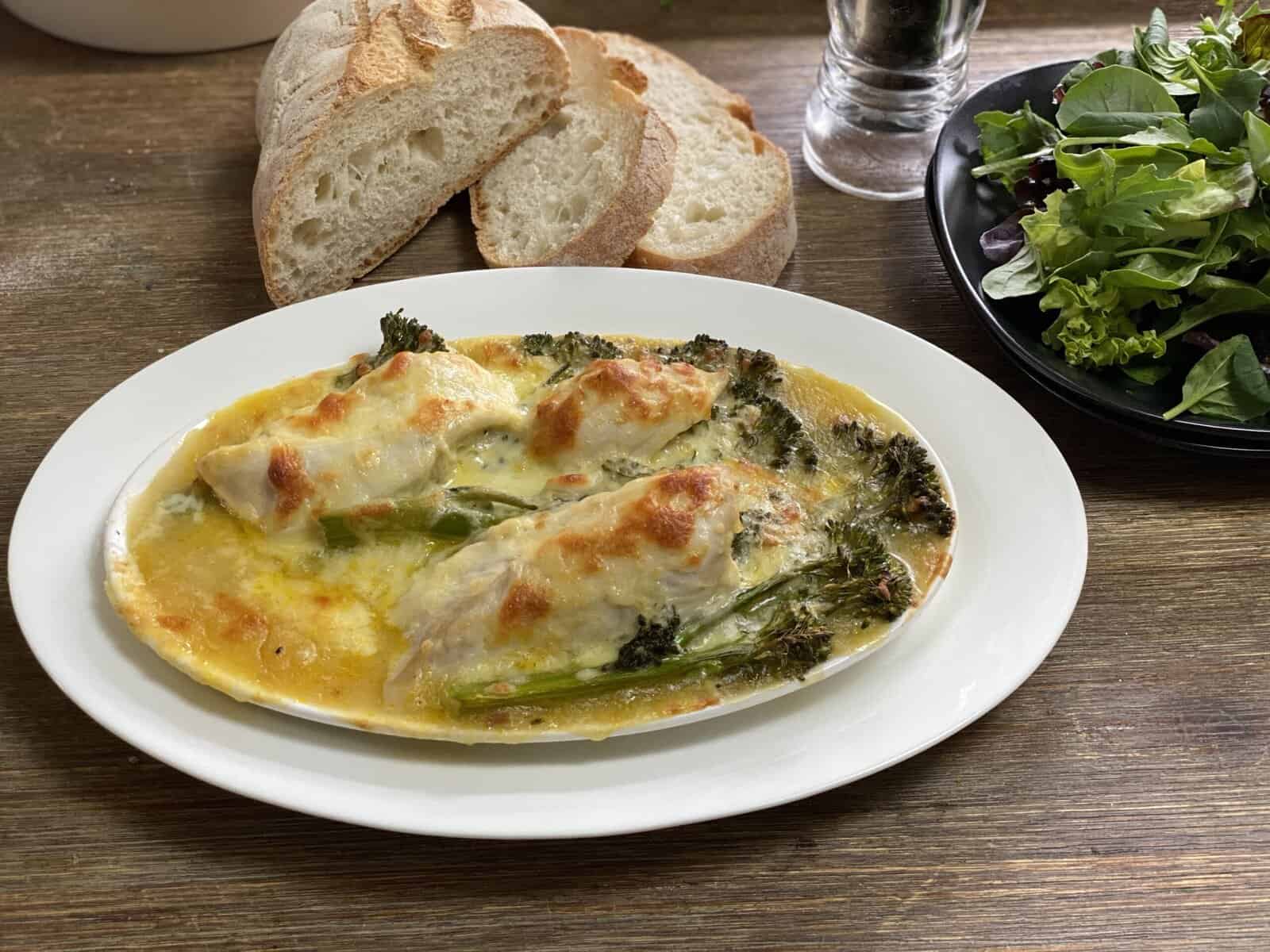 Delicious cheesy chicken baked with broccoli and rice, perfect for a comforting family dinner. Easy.