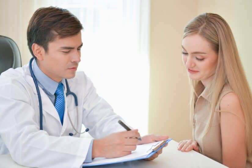Doctor discussing medical expenses with a patient.