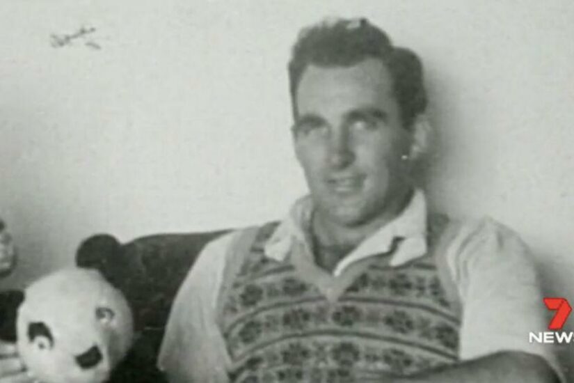 Man with a panda plush toy, black and white photo, family history.