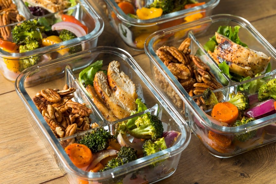 Healthy meal prep containers with fresh vegetables and grilled chicken for quick, nutritious lunches.