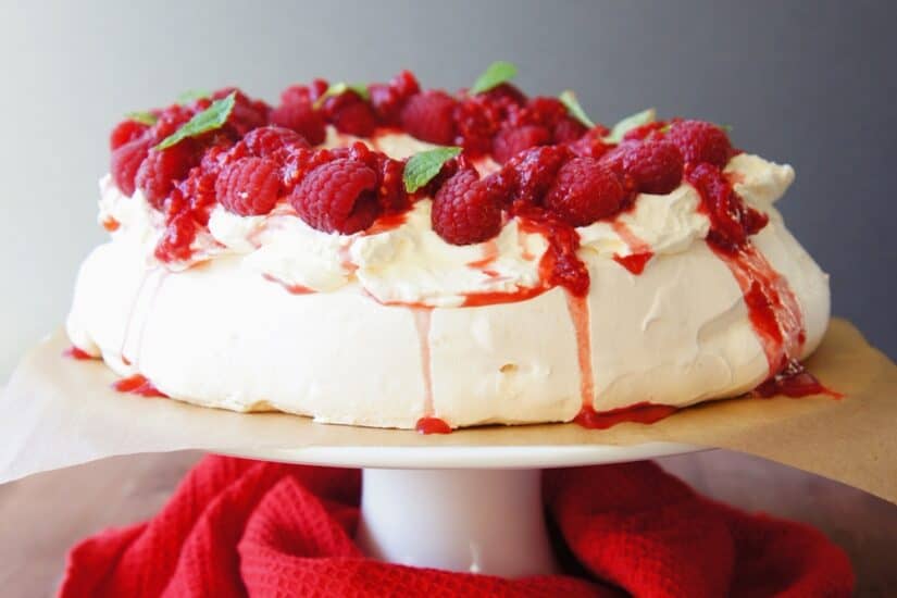 Pavlova with fresh raspberries and mint, a sugar-free dessert option.