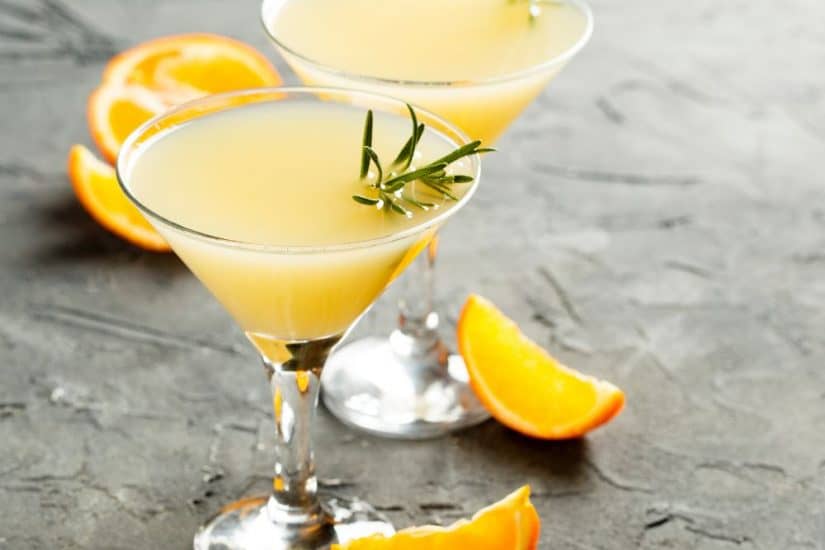 Delicious fluffy duck cocktail garnished with orange slices and rosemary. Perfect for entertaining o.
