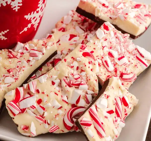 Peppermint Bark with white and dark chocolate topped with crushed peppermint candies.