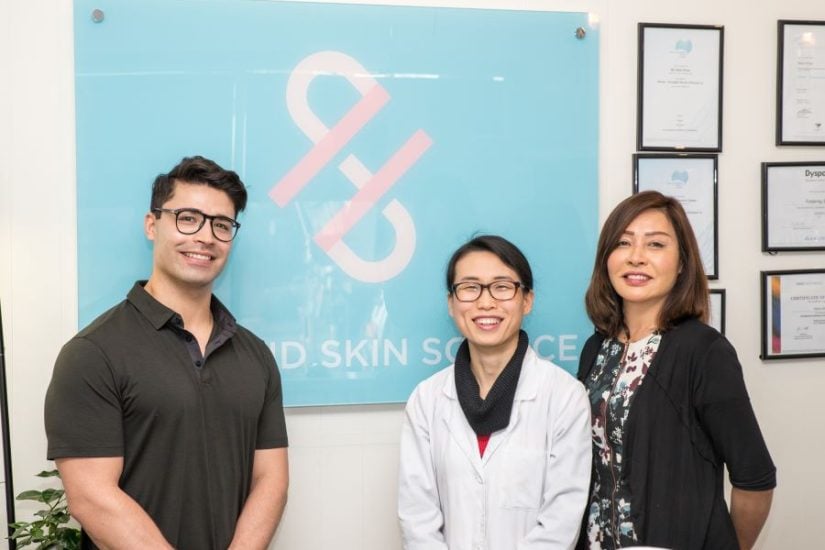 Happy team at Hair & Skin Science Clinic celebrating 20th clinic opening in Australia.