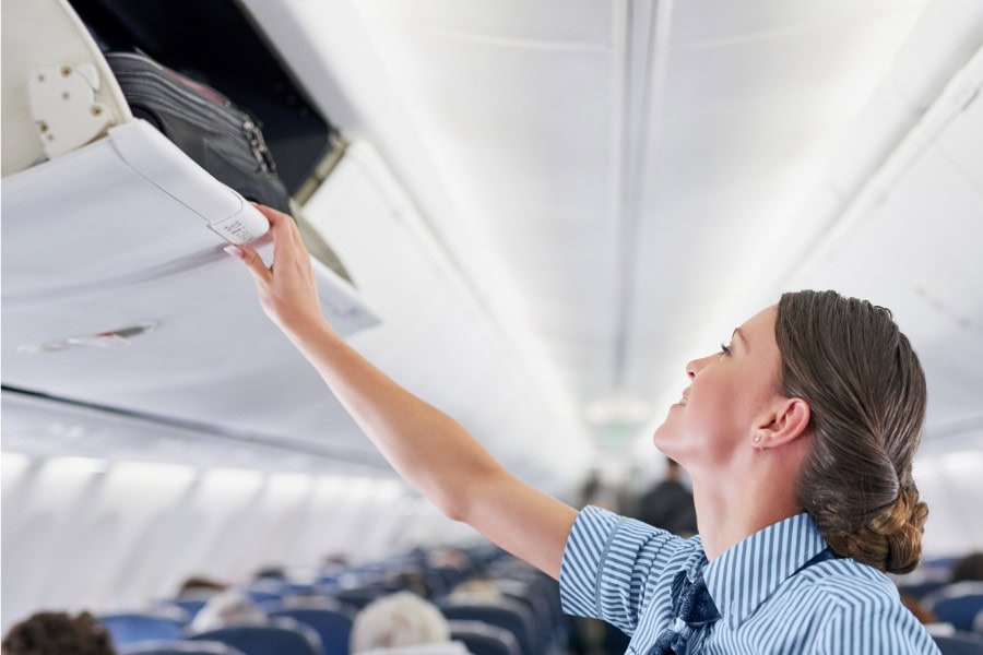 Compact stroller fits in airplane overhead compartment for travel convenience.